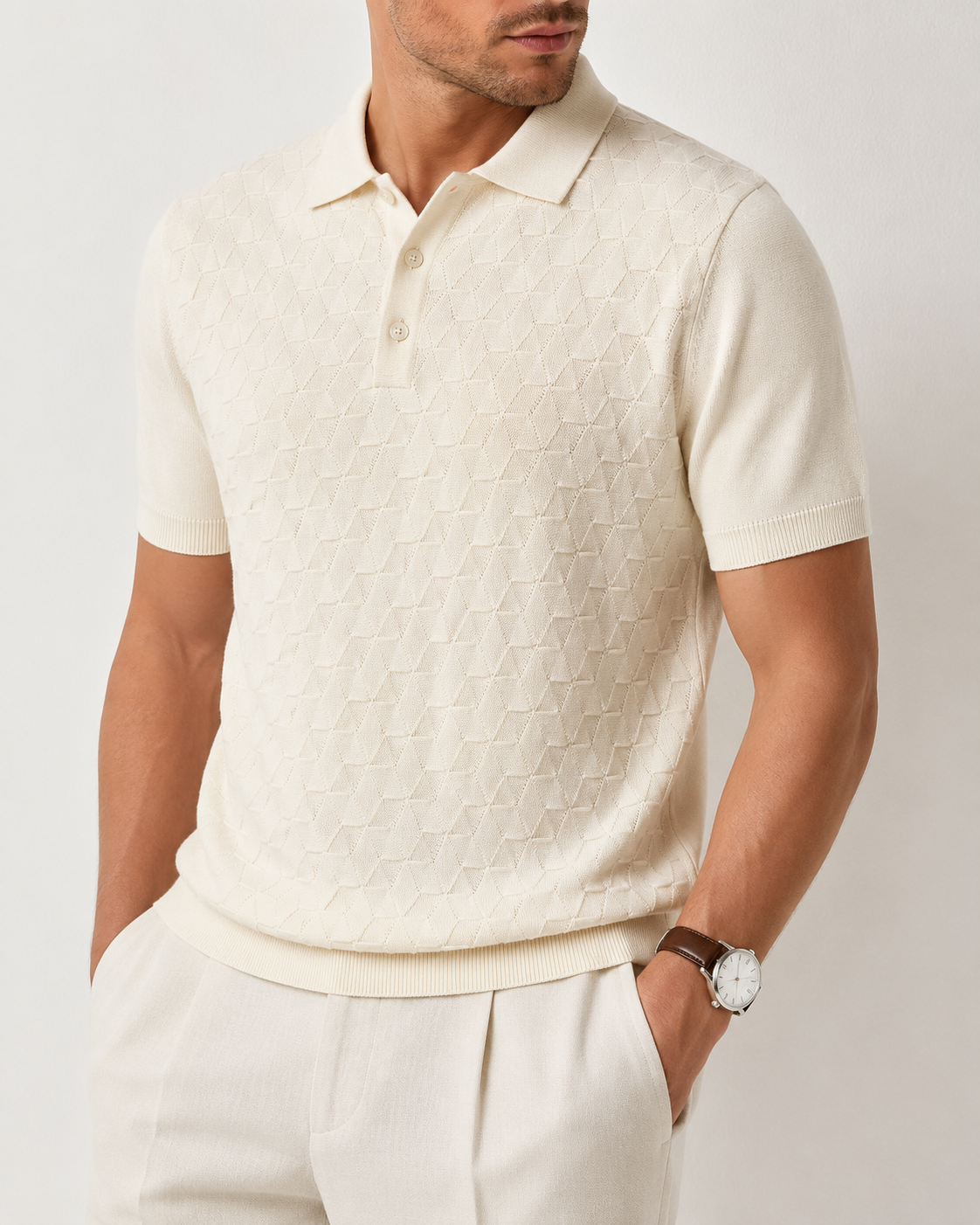 LEAF Knit Polo in cream — angled torso close-up showing the ribbed cuffs, hem and raised knit texture