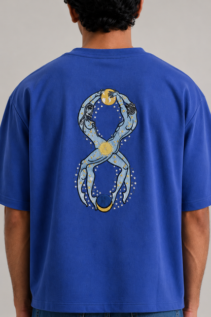 Eternal Truth tee in royal blue — back graphic close-up, two figures looped into an infinity with a gold sun