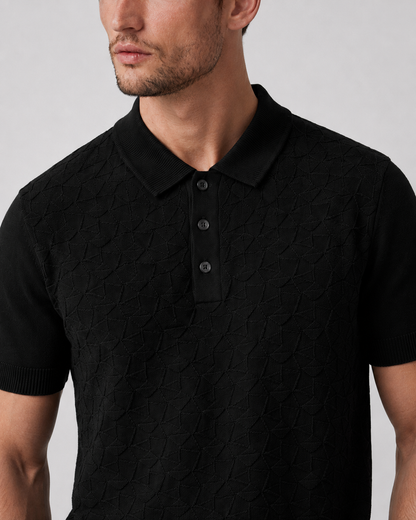 LEAF Knit Polo in black — close-up of the ribbed collar and three-button placket against the raised knit