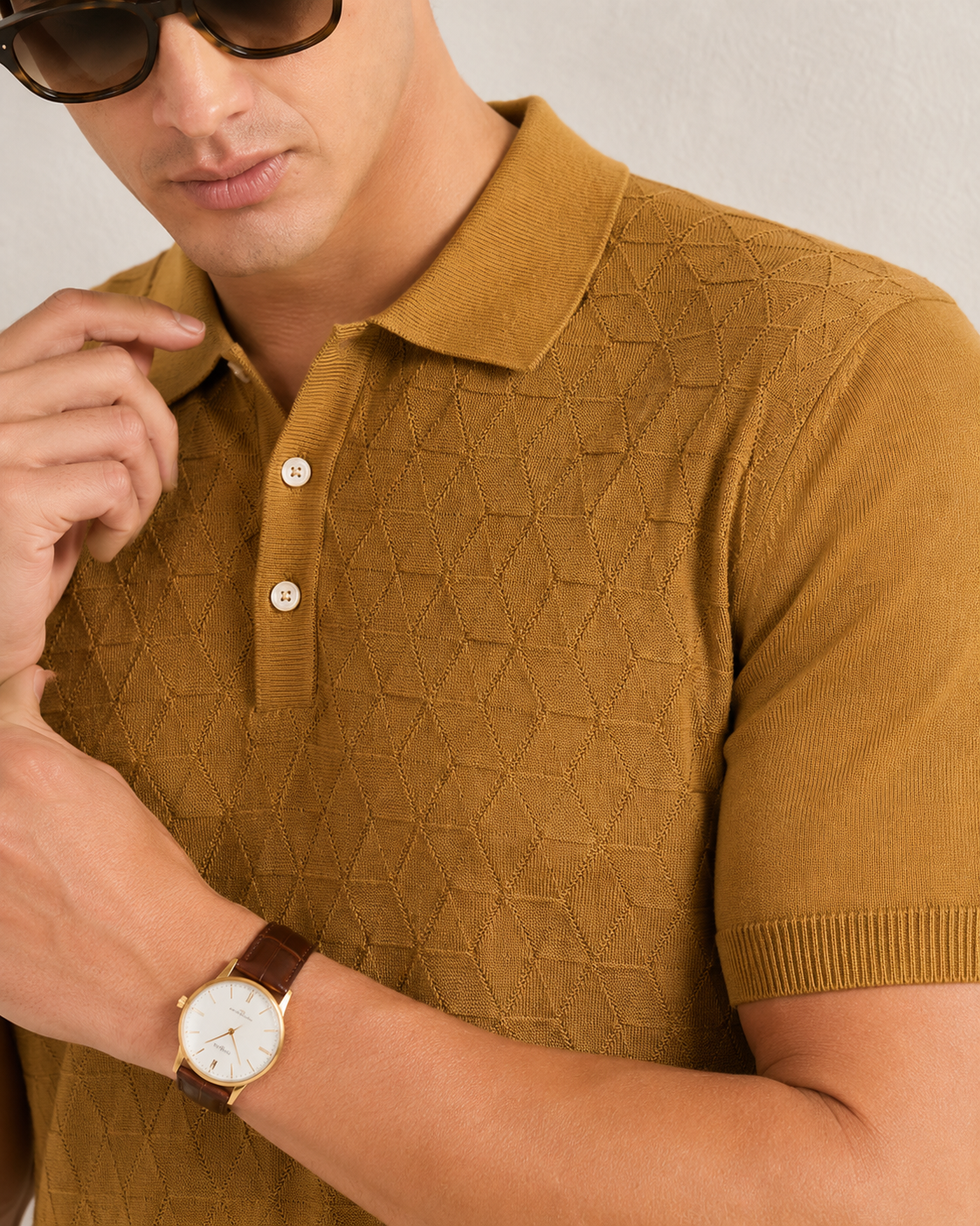 LEAF Knit Polo in camel — close crop on the collar and two placket buttons, knit texture in relief