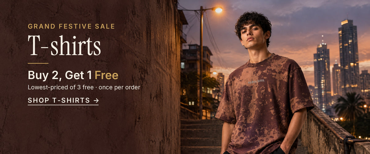 Grand Festive Sale, T-shirts: Buy 2, Get 1 Free. Lowest-priced of 3 free, once per order. A man in the oversized Raktprint tee stands on a city stairway at dusk. Shop T-shirts.