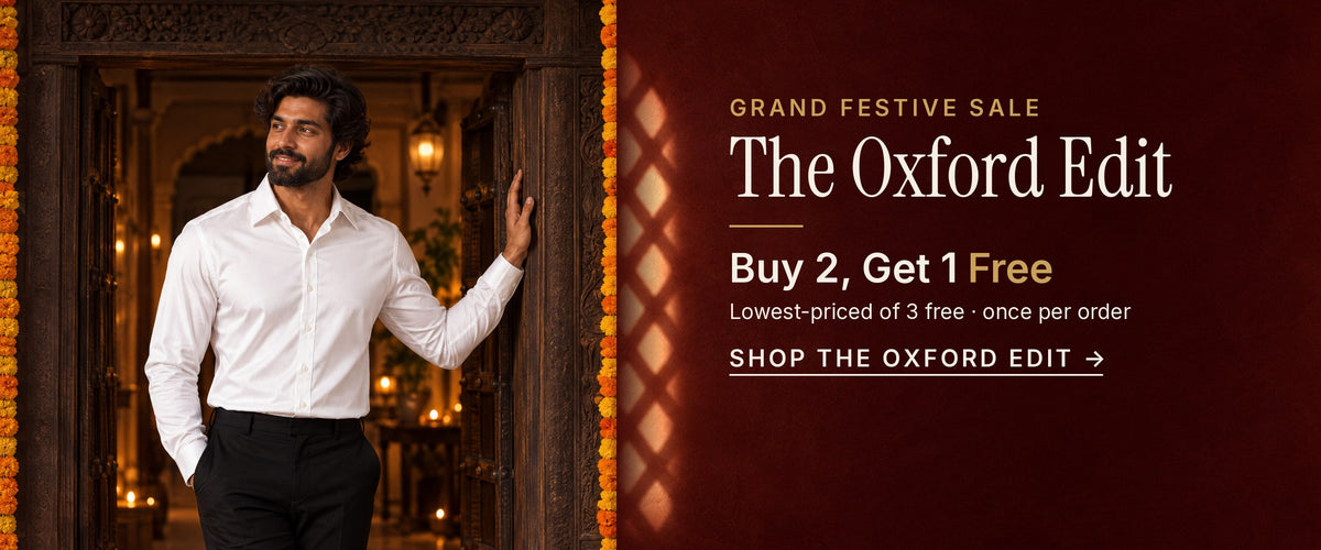 Grand Festive Sale, The Oxford Edit: Buy 2, Get 1 Free. Lowest-priced of 3 free, once per order. A man in the Optic White Sateen shirt leans in a carved doorway framed with marigolds and diyas. Shop the Oxford Edit.
