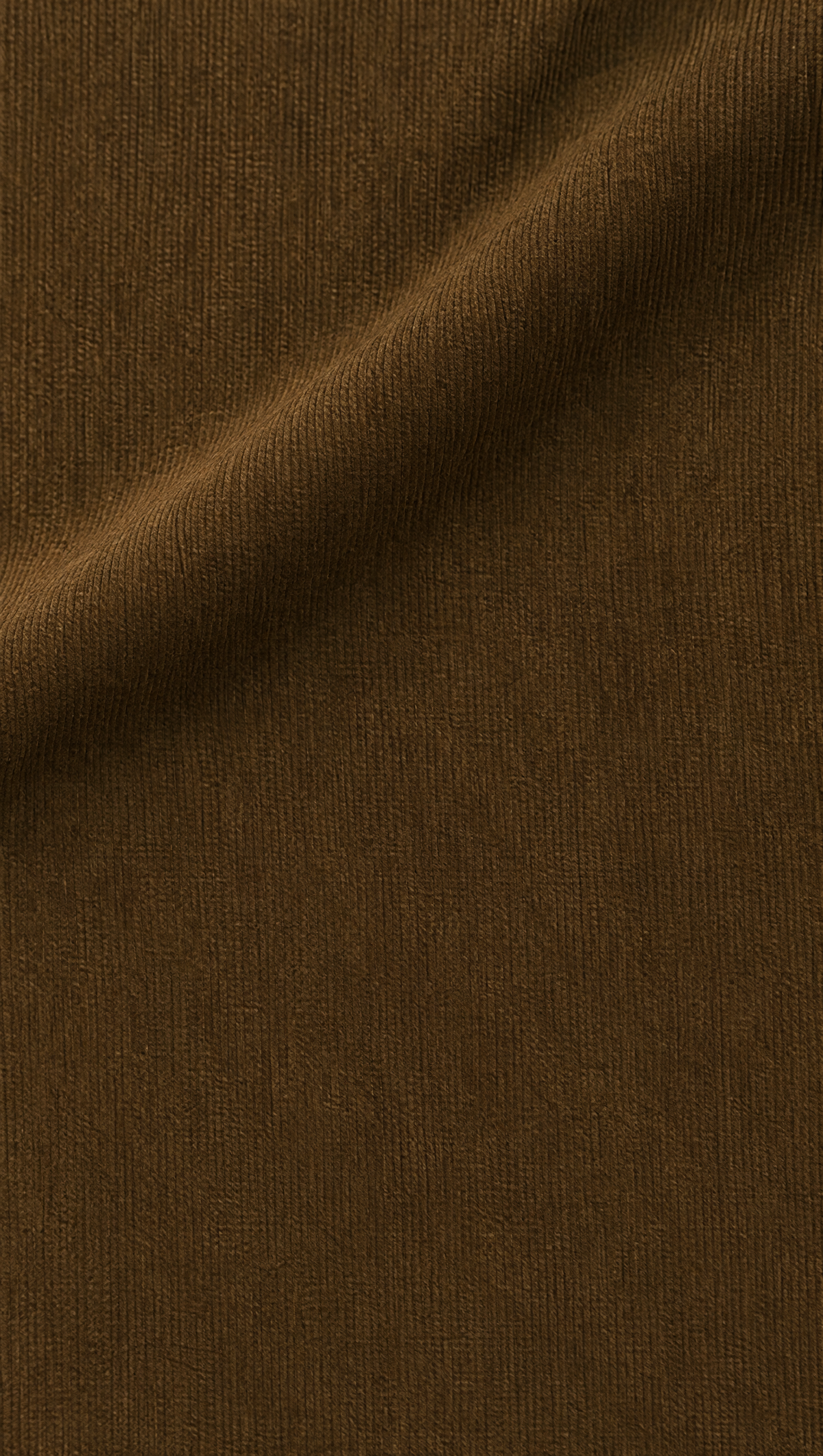 Close-up of the fine-wale corduroy of the MRIDA joggers in deep brown
