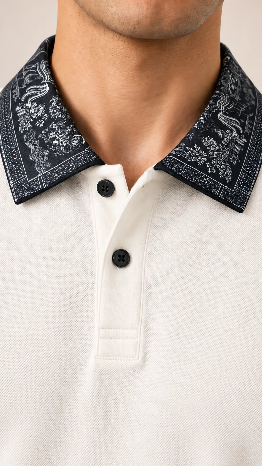 Close-up of the navy ornamental-print collar and black-button placket on the cream Full Sleeve Oxford Polo