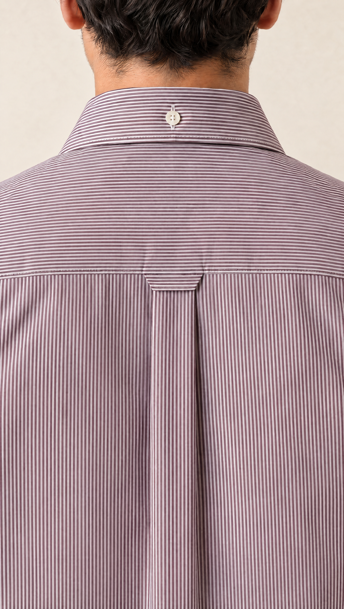 The back of the Oxblood Stripe Shirt: crosswise-striped yoke, centre collar button and box pleat