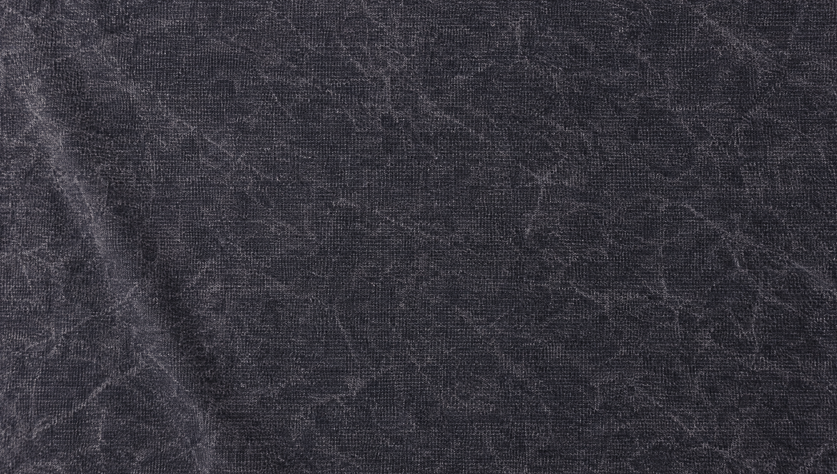 Edge-to-edge close-up of washed-charcoal French terry from the Phoolonix tee